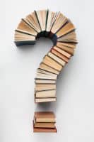 Colorful open books arranged in a question mark shape, symbolizing curiosity and storytelling.